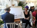 Chris caricature artist at Mad Hatters Tea Party 2014
